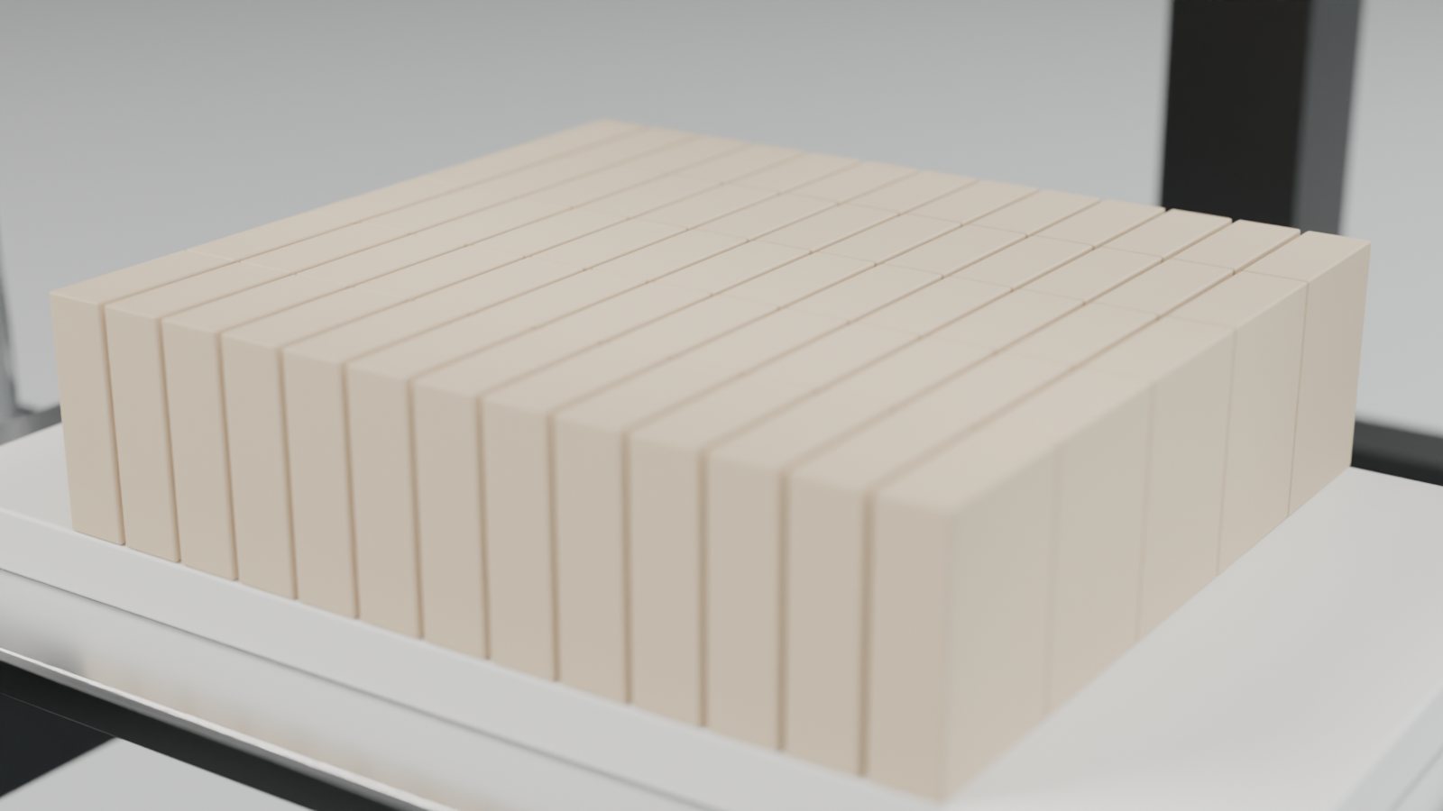 Freshly cut one-inch soap bars standing on a white HDPE pad